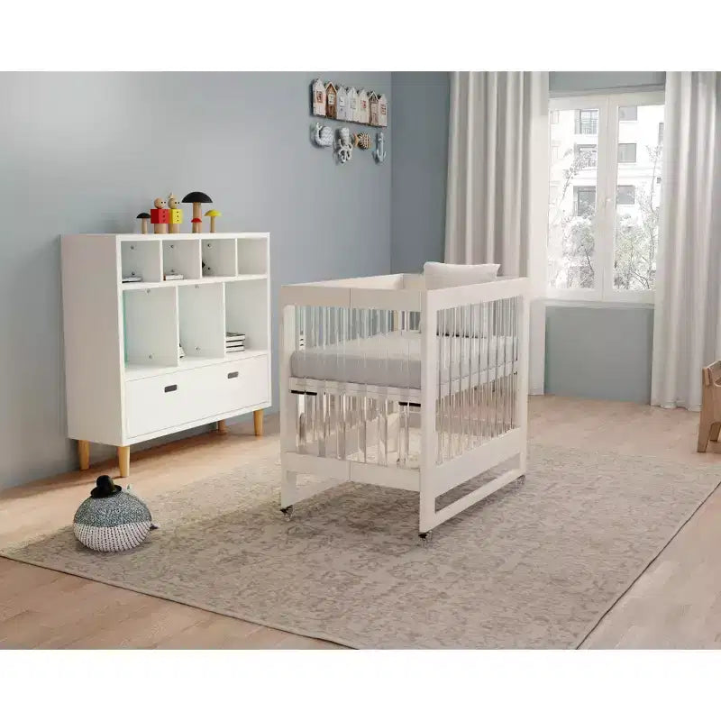 MelO Caress Foldable Crib, Modern Acrylic Frame with 4 Height Levels, Smooth Wheels &amp; Easy Folding Design  Washed White