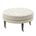 Porthos Home Indy Fabric Round Cocktail Ottoman with Rubberwood Legs and Wheels